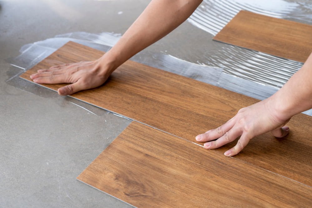 Professional installing vinyl flooring in a Frankston home
